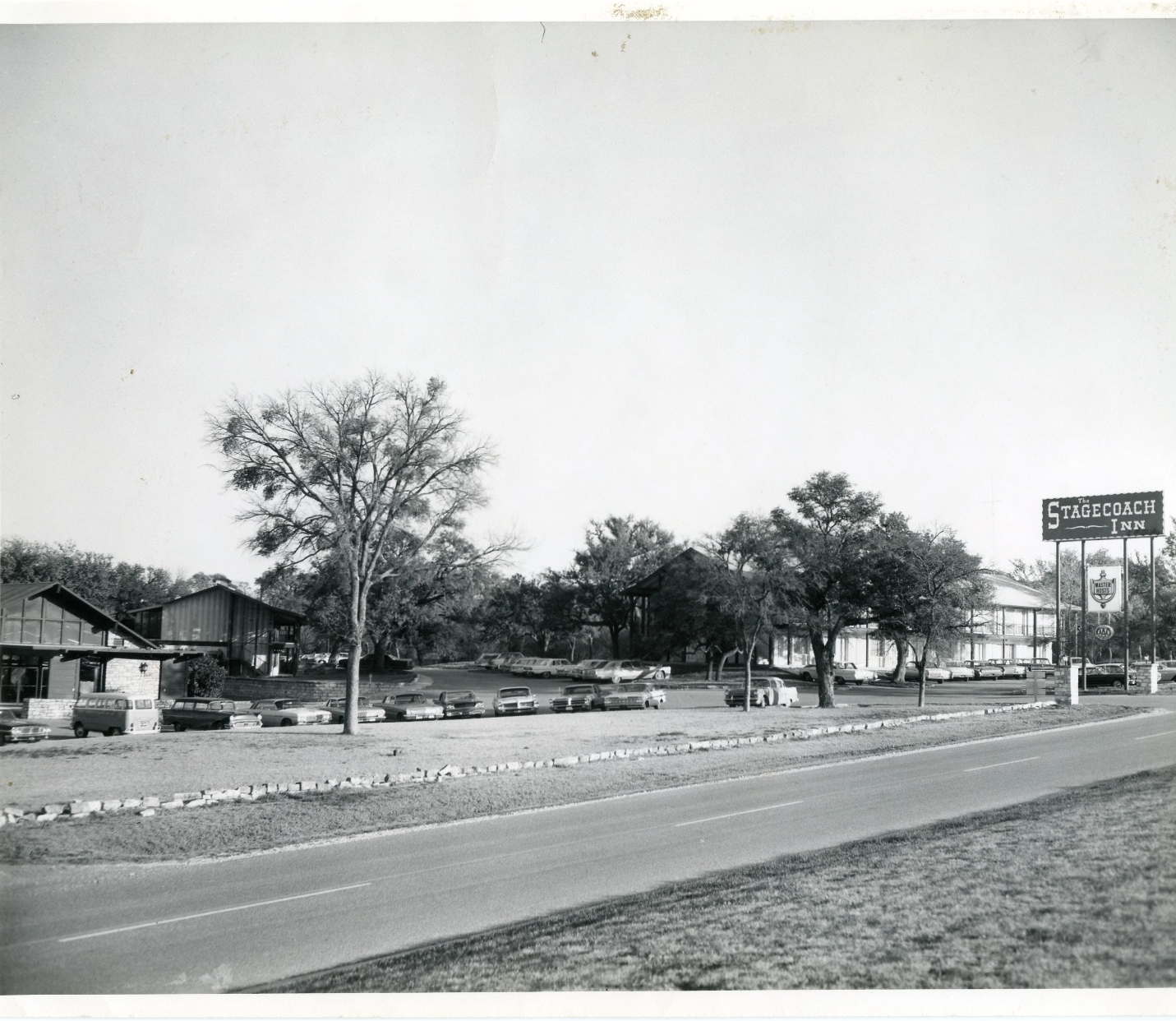 a street with a sign and trees