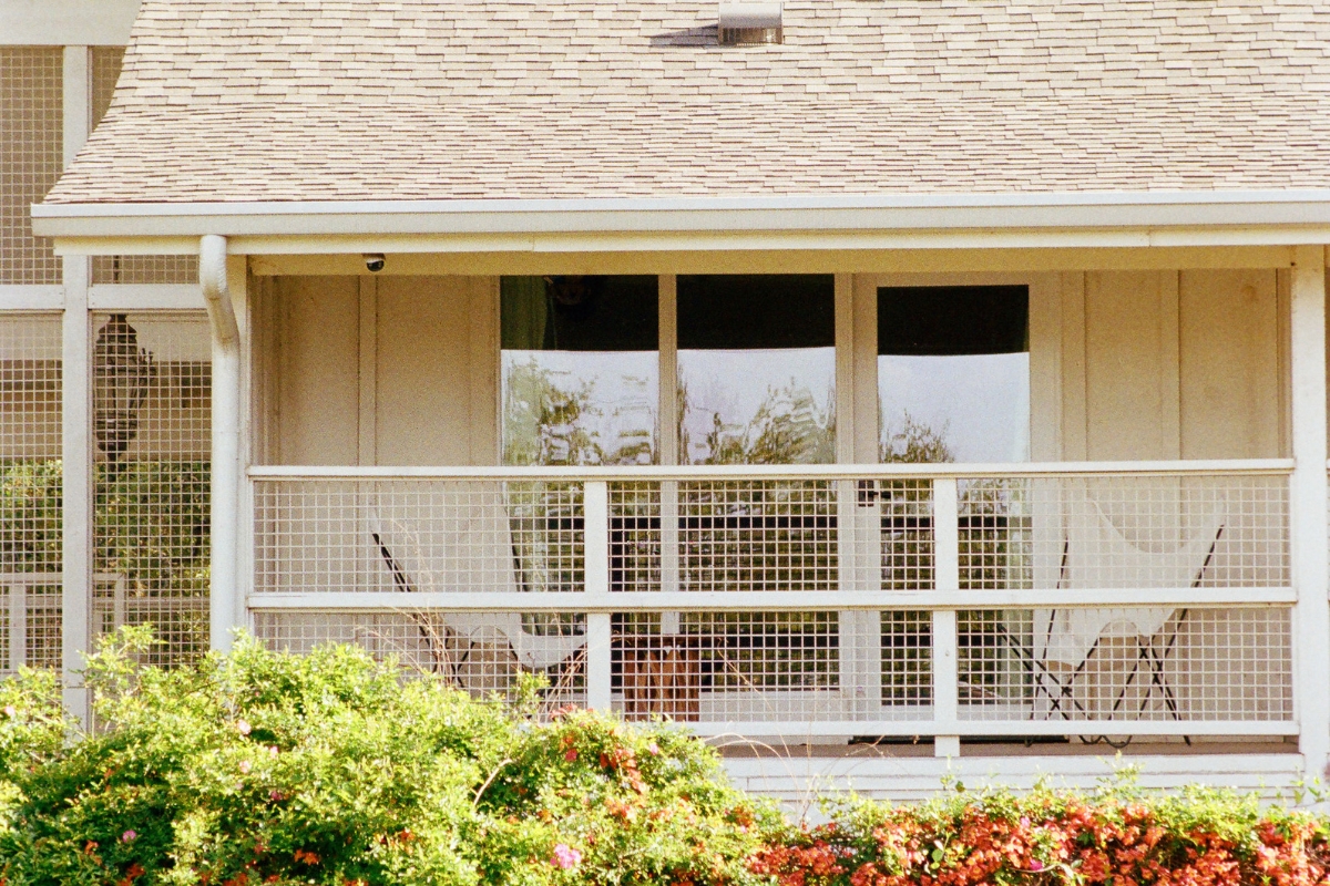 a white balcony with a white railing