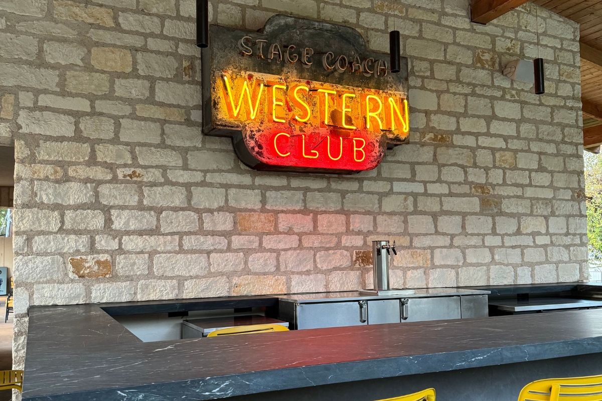a sign on a brick wall
