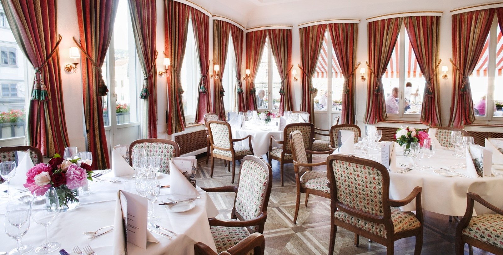 a restaurant with tables and chairs