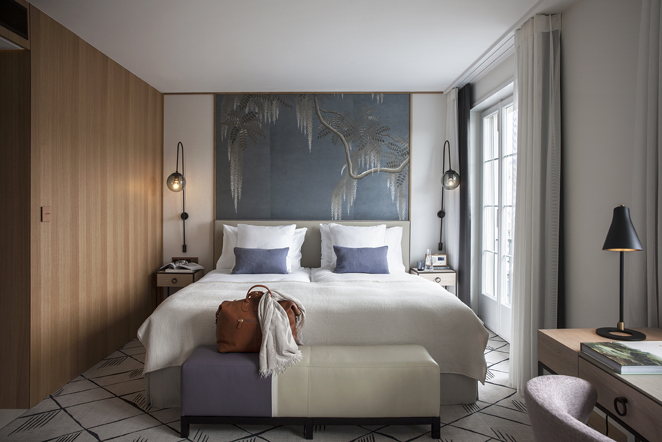 a bed with a large bed and a large bench