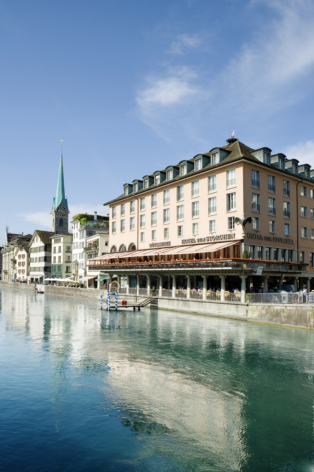 a river with buildings and a church