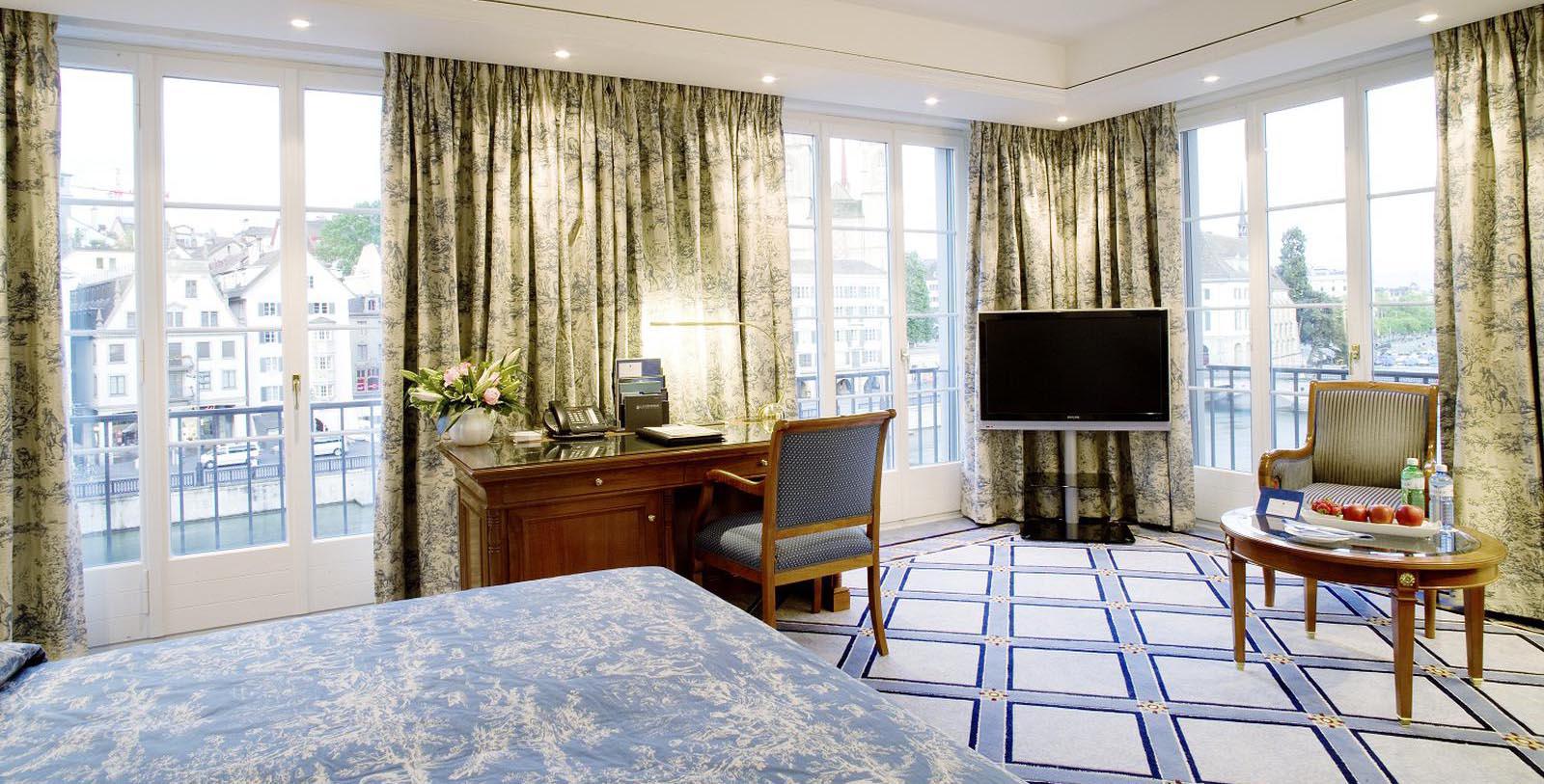 a room with a desk and a television