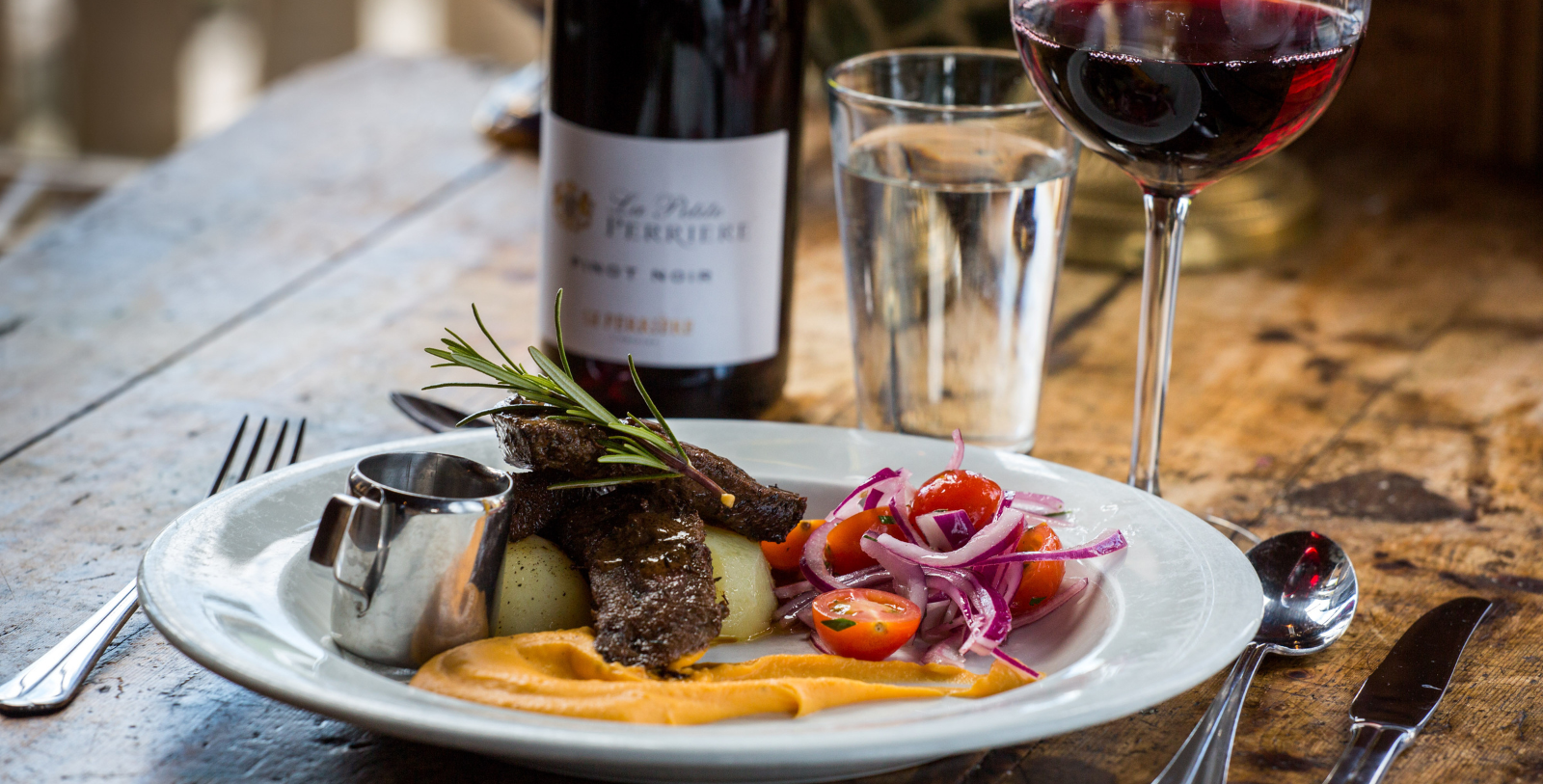 a plate of food and wine