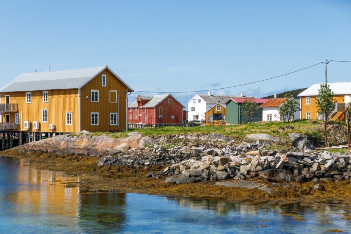 a group of houses by a body of water