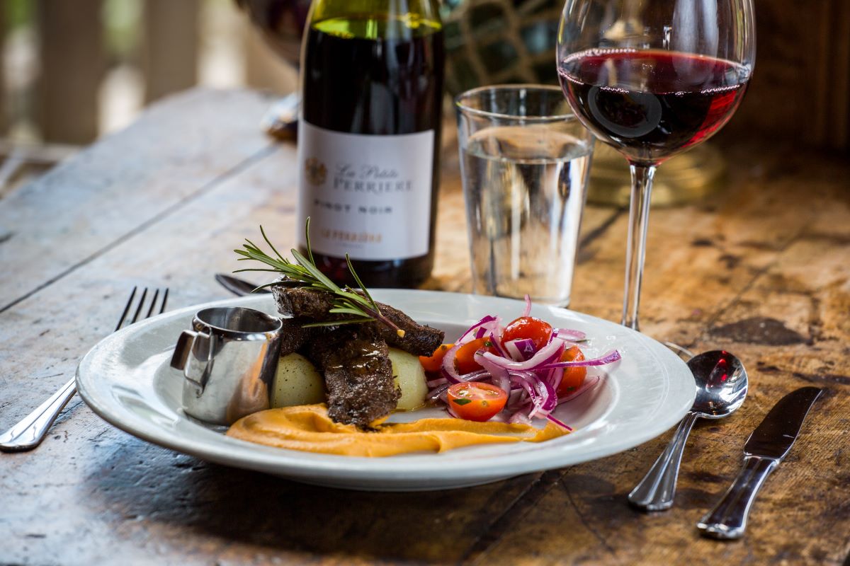a plate of food and wine