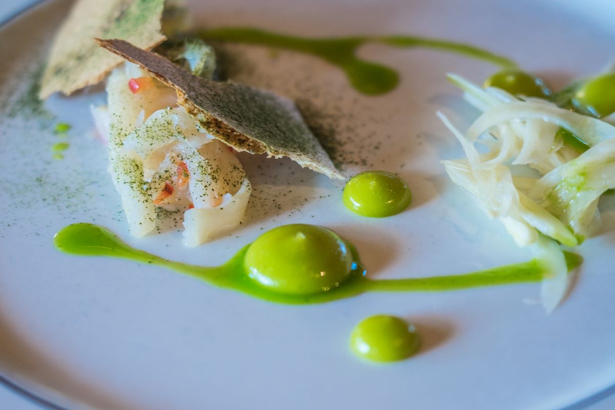 a plate of food with green sauce