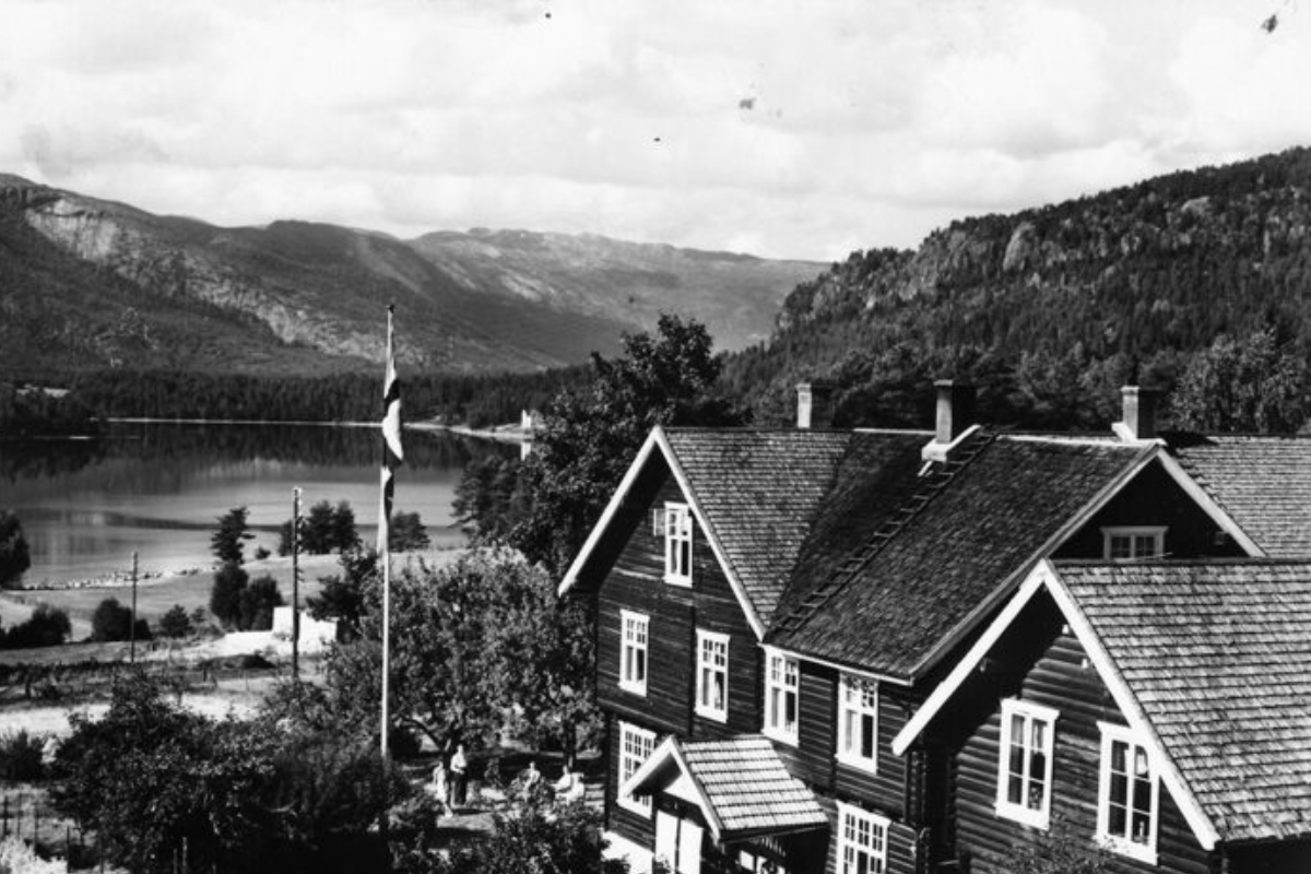 a house with a lake in the background