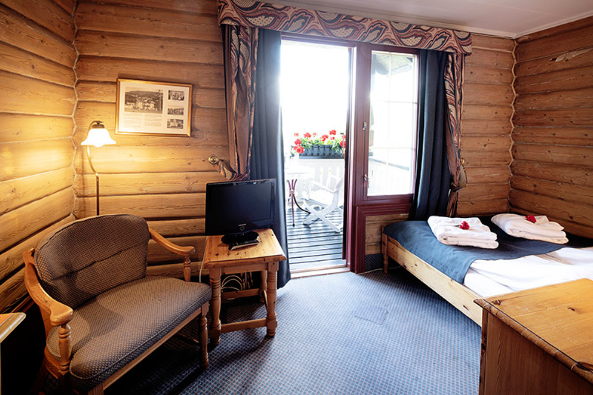a room with a television and a bed