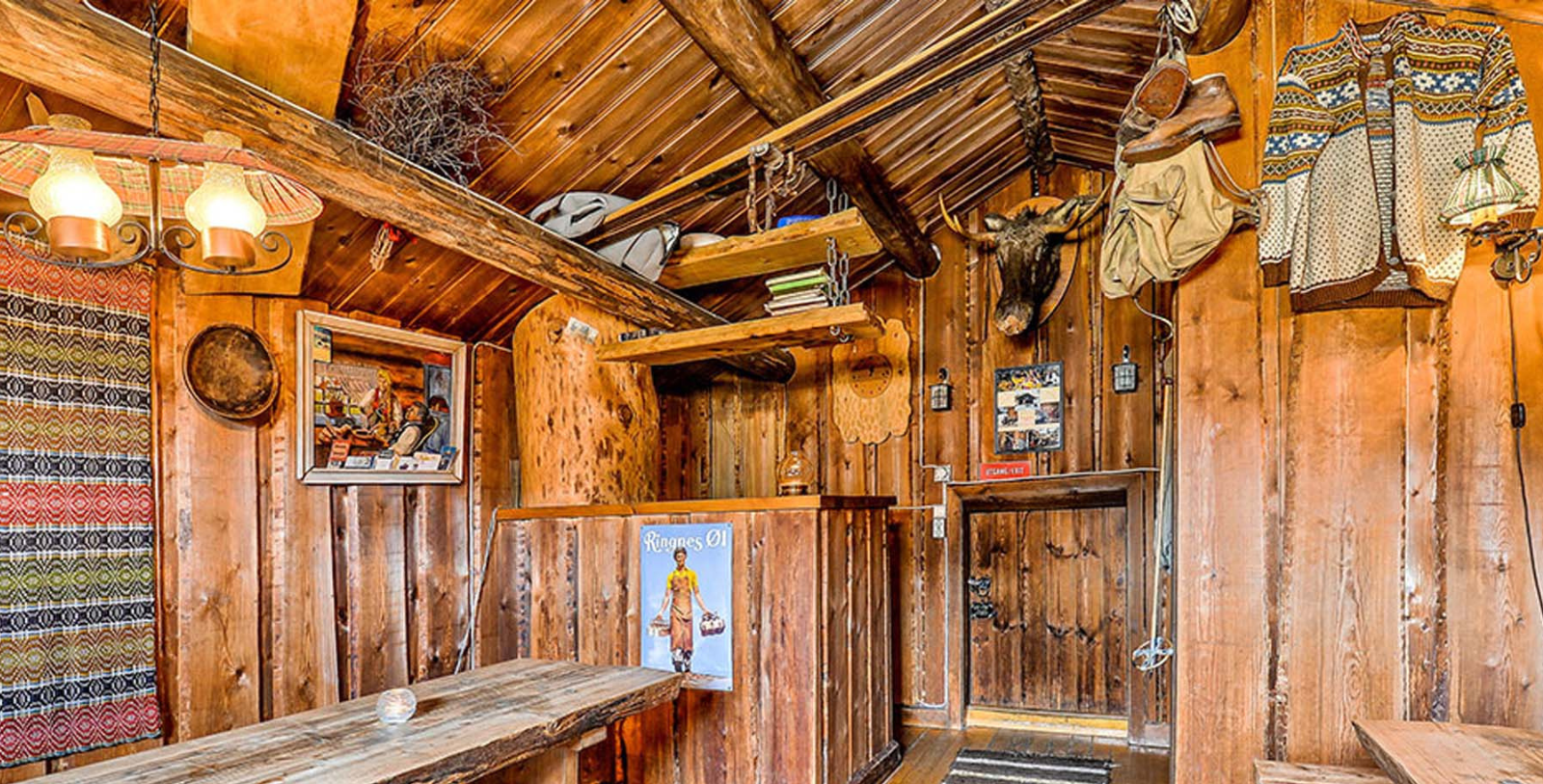 a room with wood walls and a wooden table