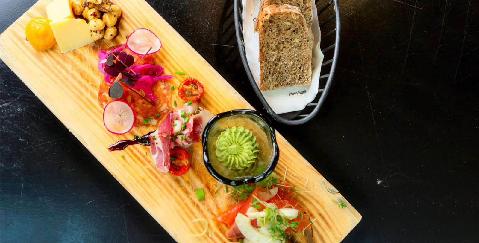 a plate of food and a basket of bread