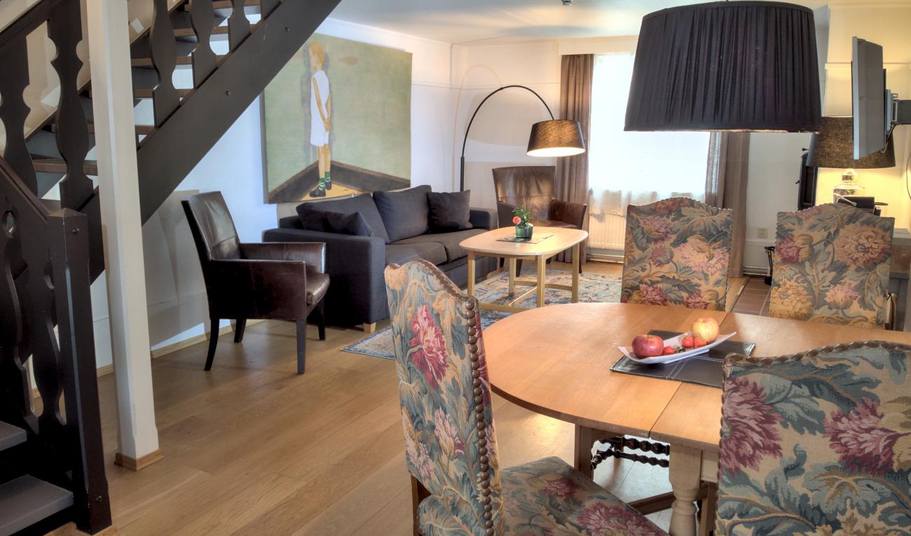 a living room with a couch and a table