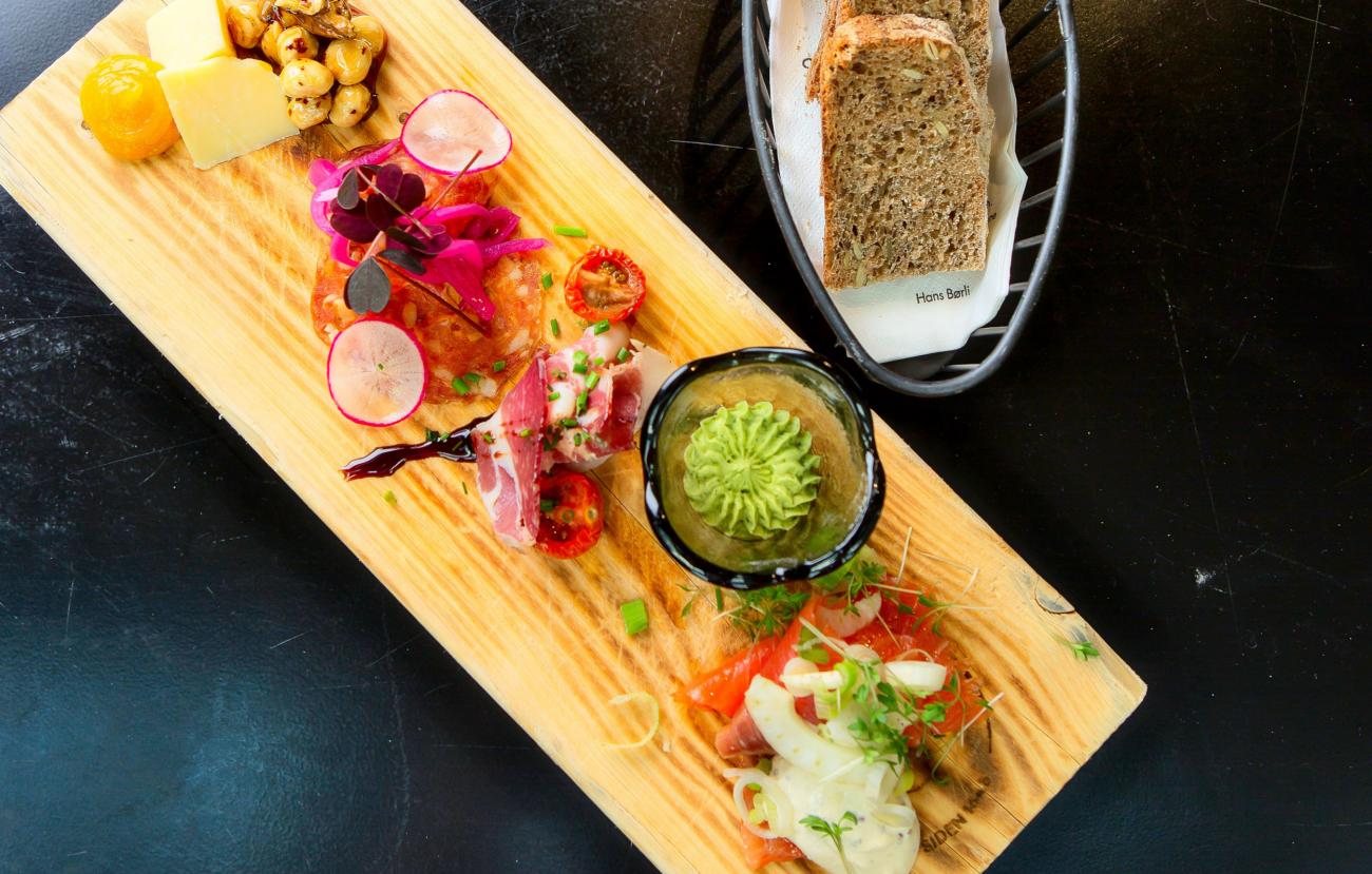 a wooden board with food on it