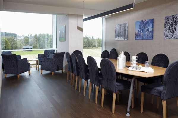a room with a table and chairs