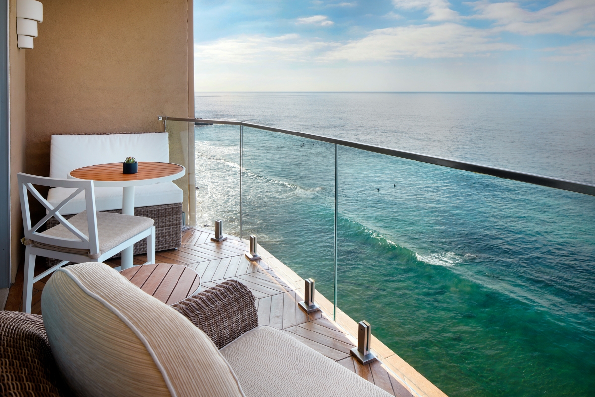a balcony with a view of the ocean