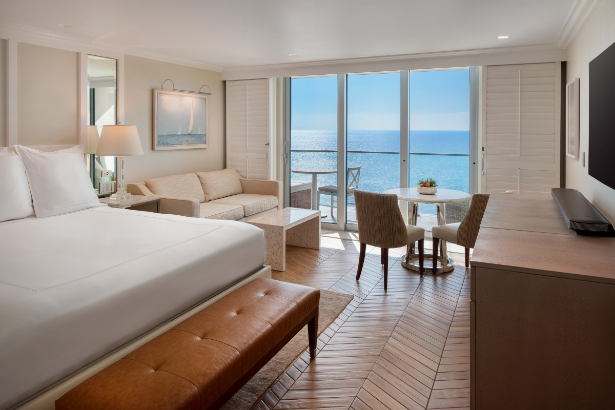 a room with a large window overlooking the ocean