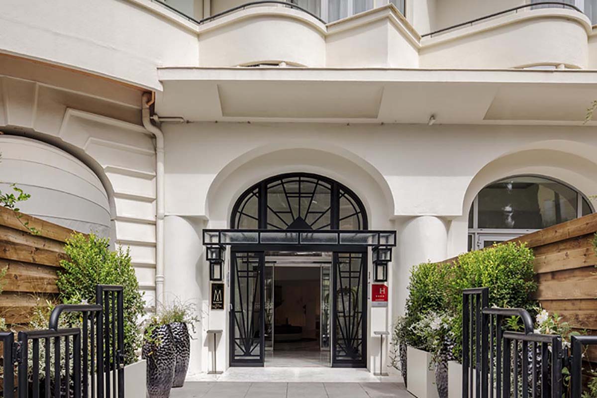 a white building with black doors
