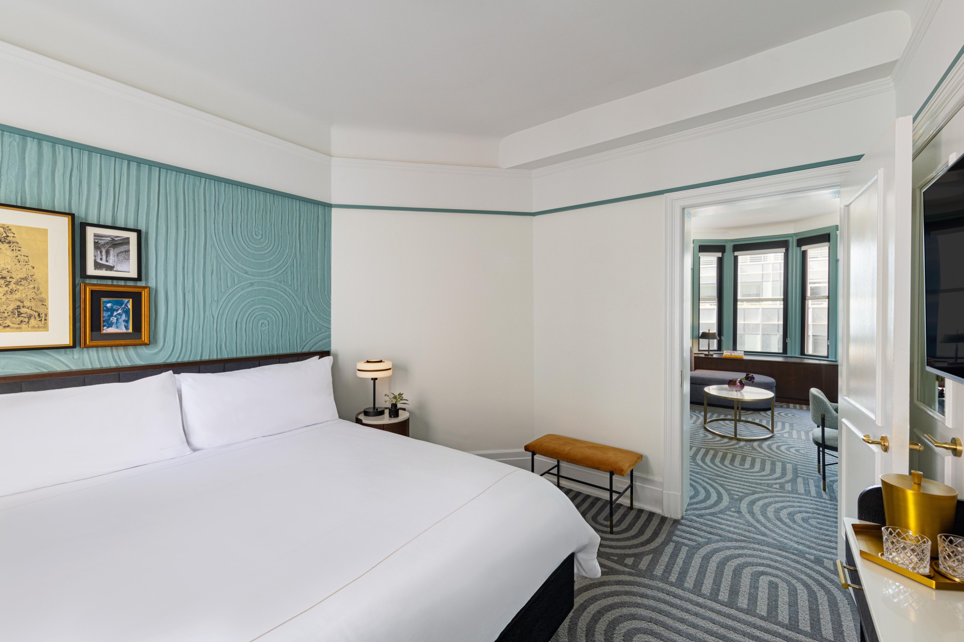 a bedroom with a bed and a table