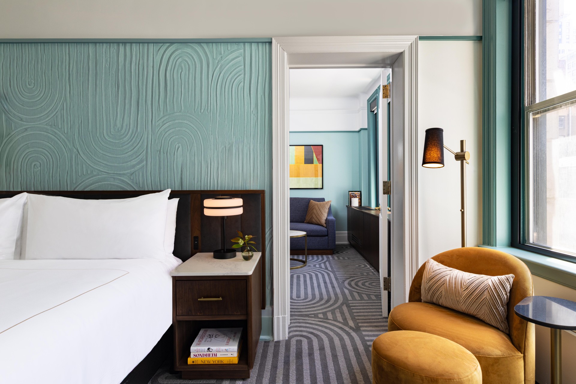 a room with a bed and a chair