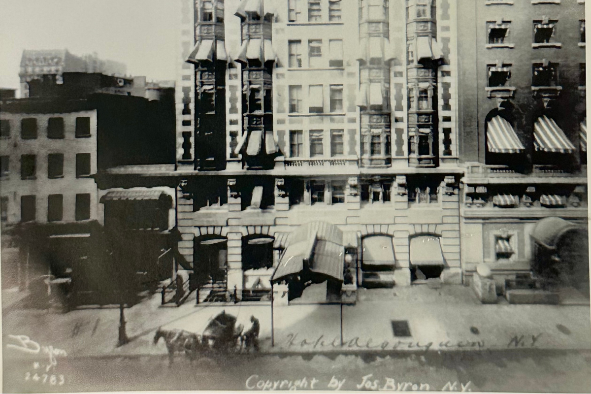 a horse drawn carriage in front of a building