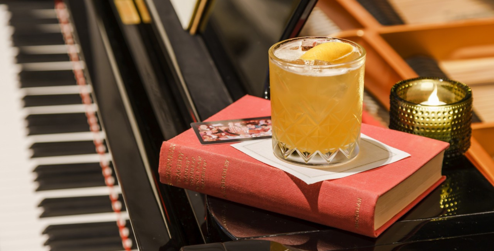 a glass of drink on a book