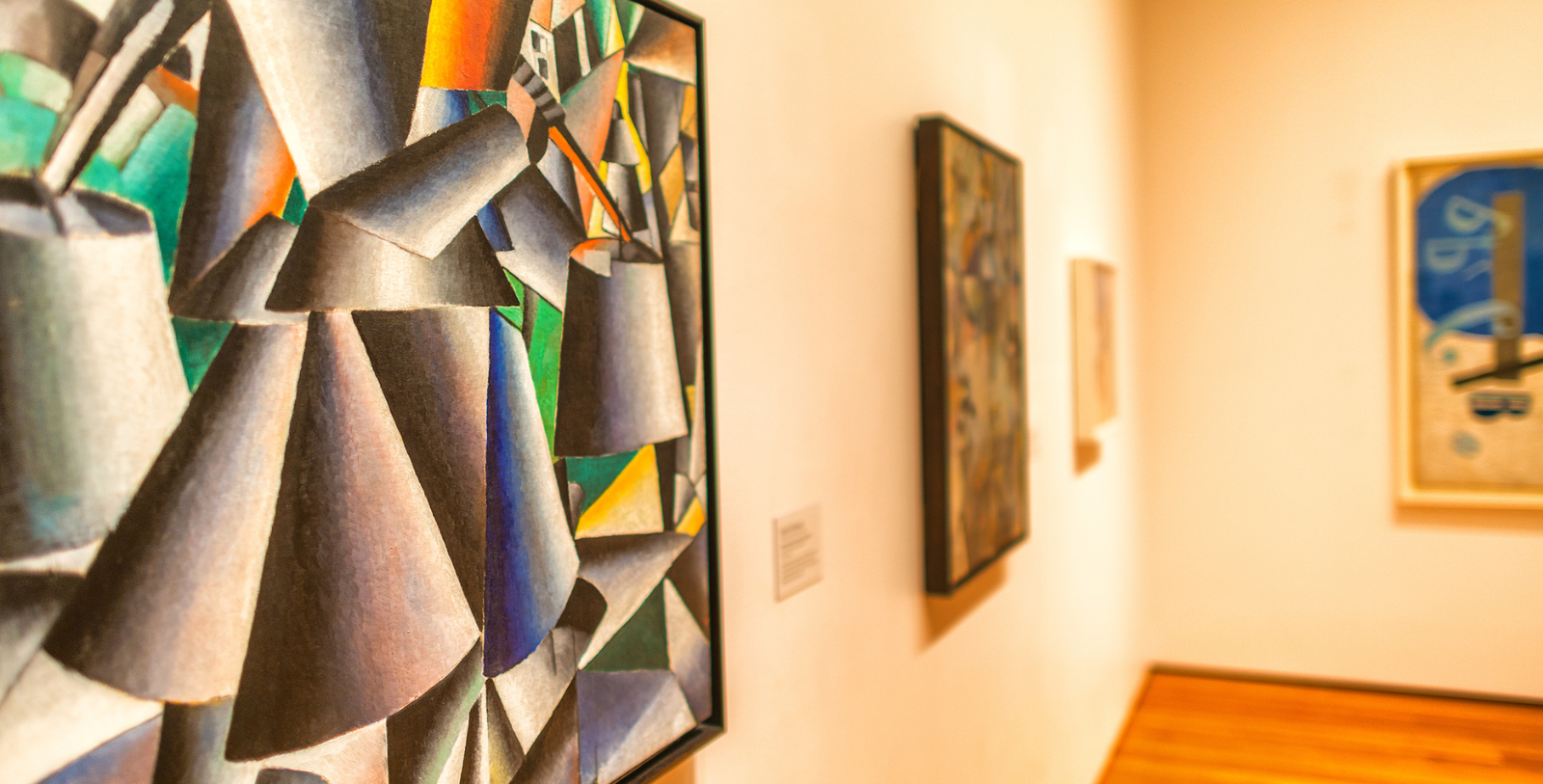 a group of paintings on a wall
