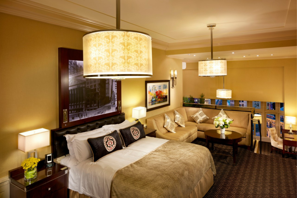 a room with a bed and couches