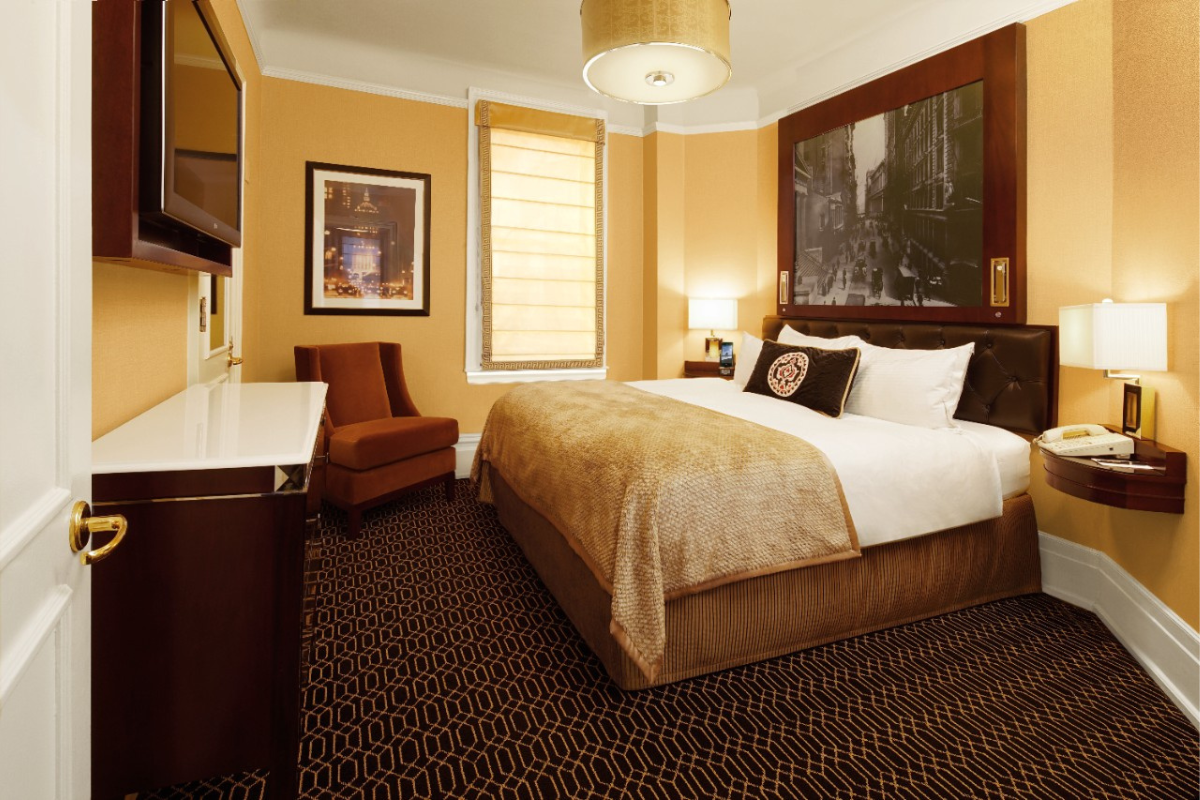 a room with a bed and a chair