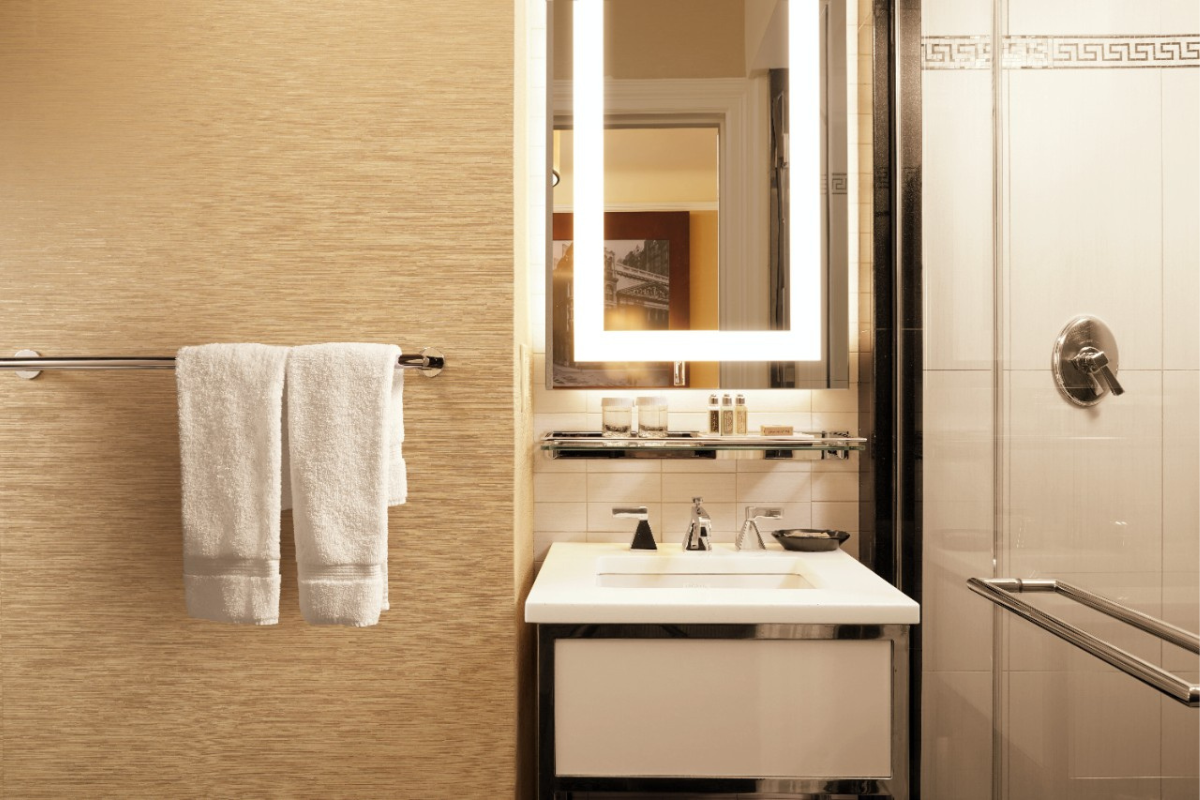 a bathroom with a mirror and a sink