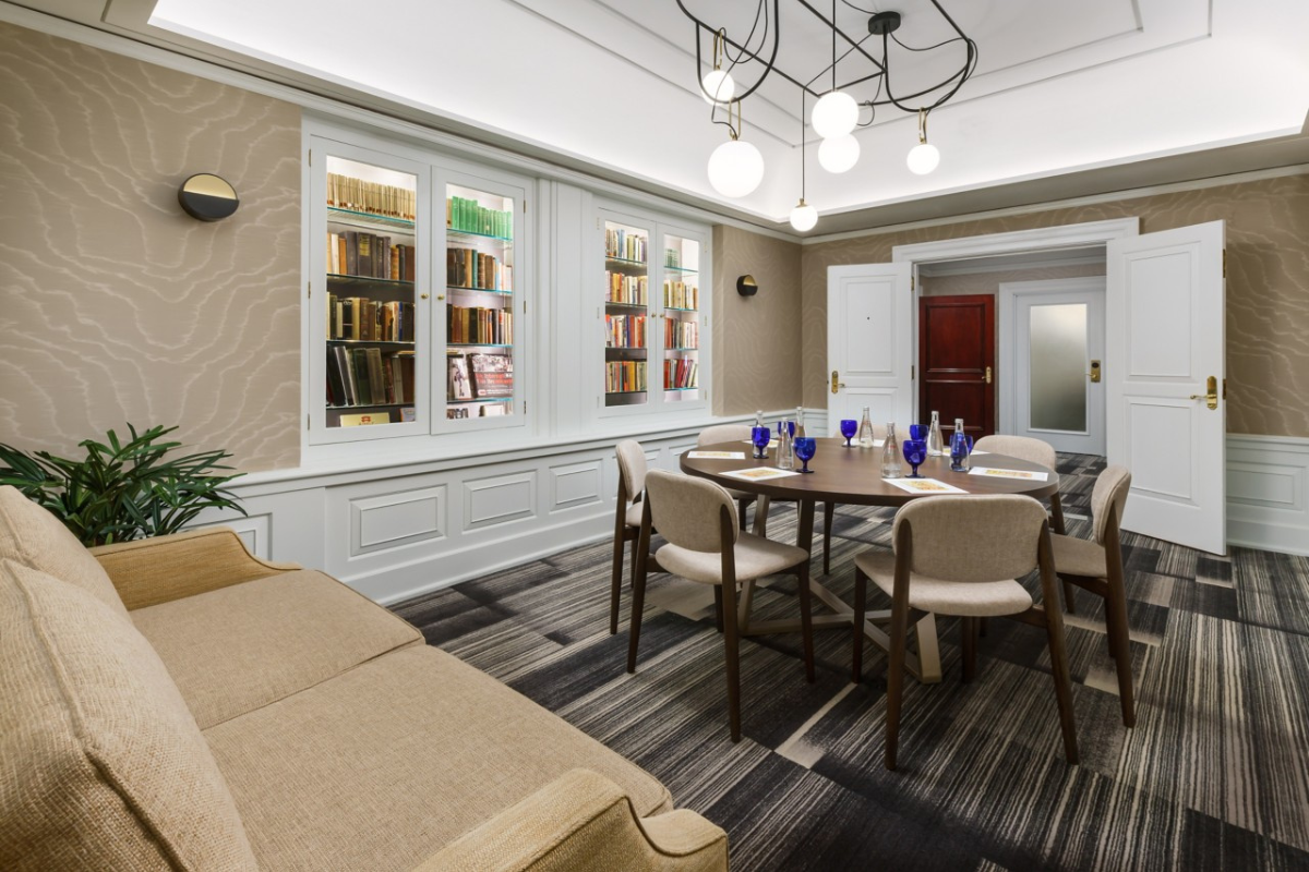 a room with a table and chairs