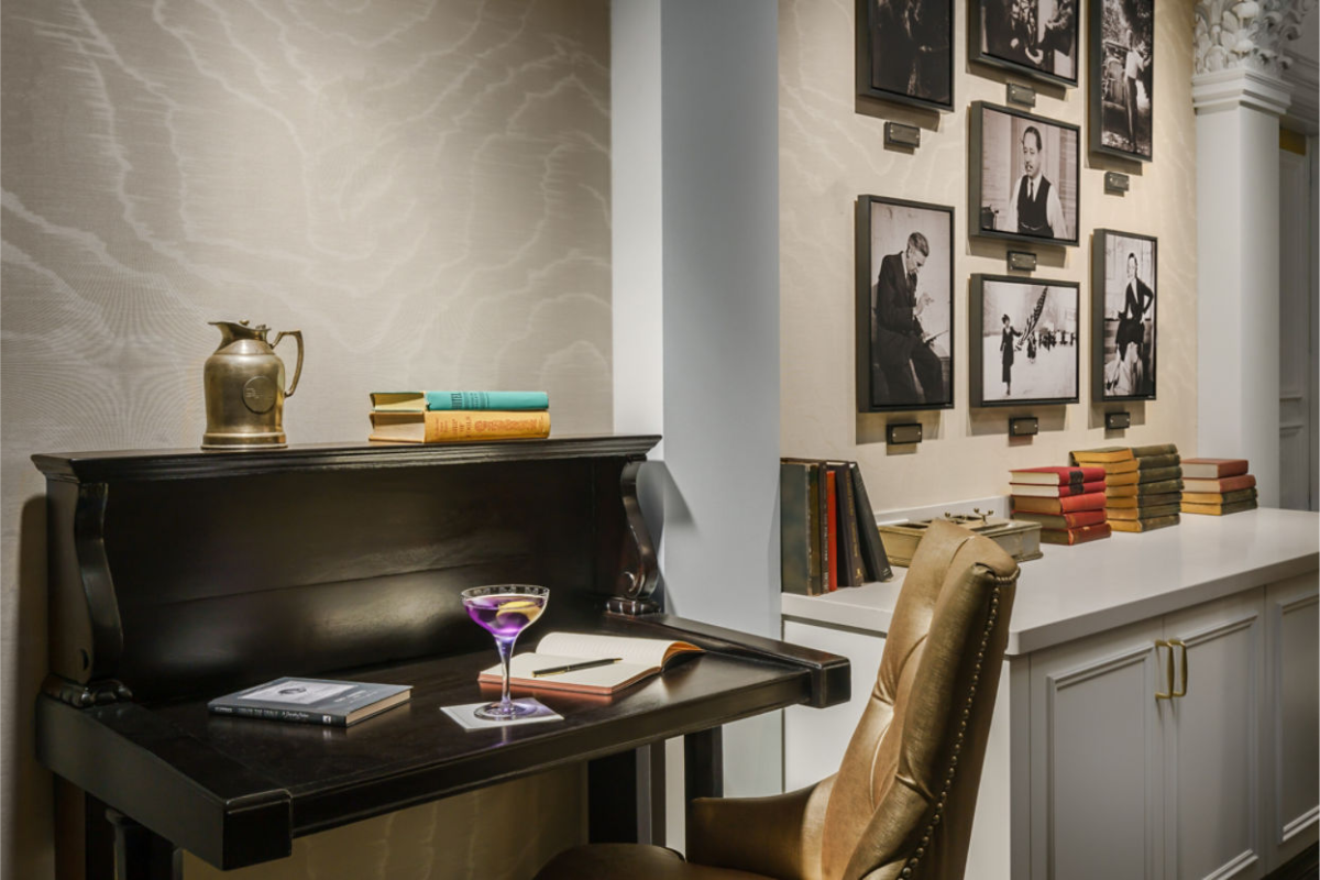 a desk with a glass of wine on it