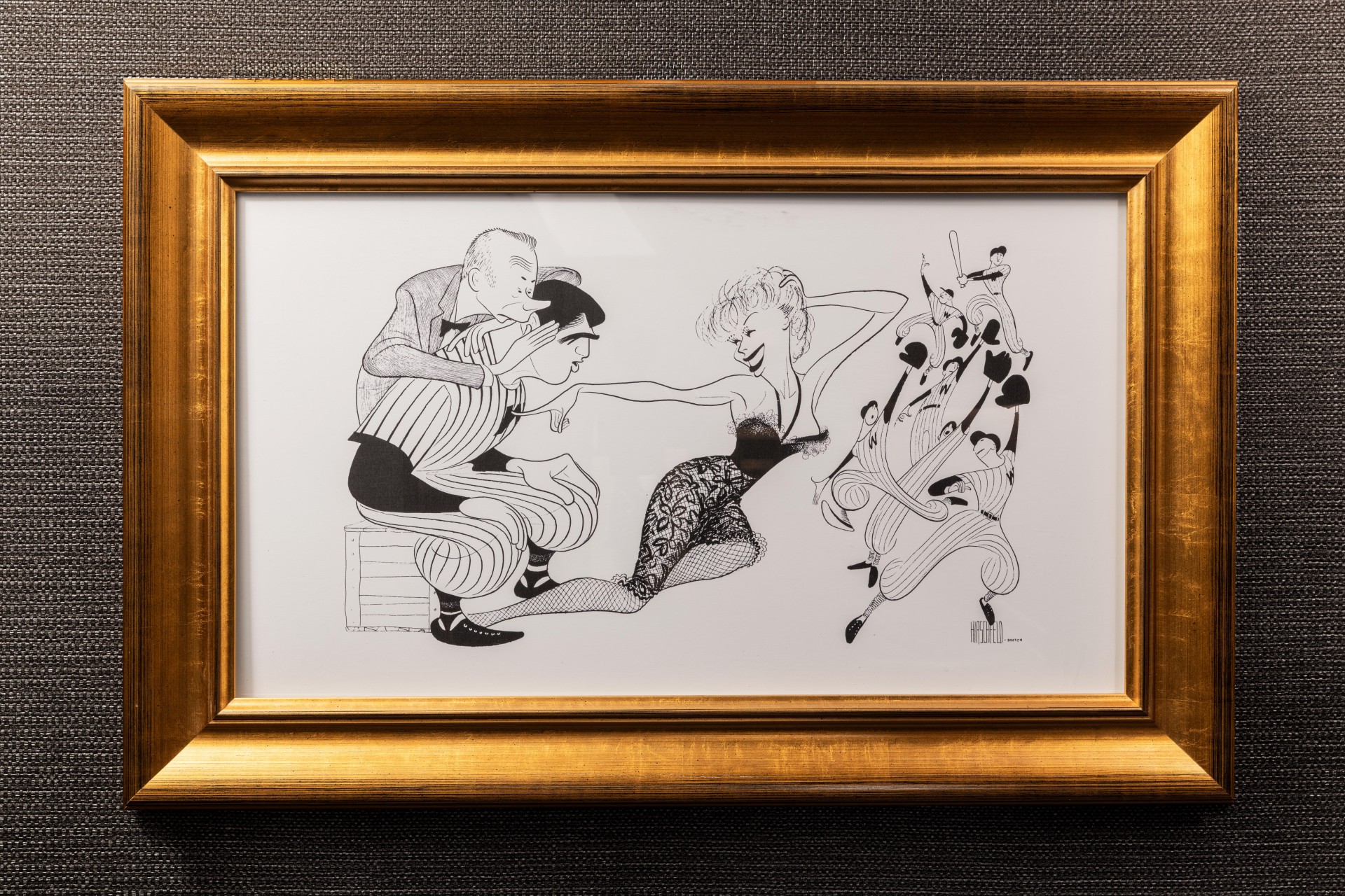 a framed picture of a couple of people dancing