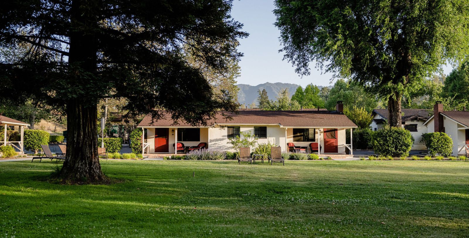 a house with a lawn and trees