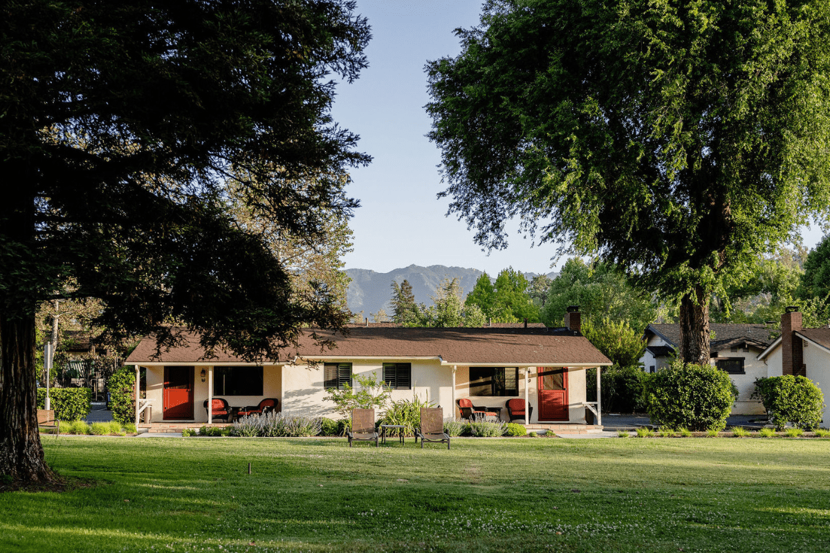 a house with a lawn and trees