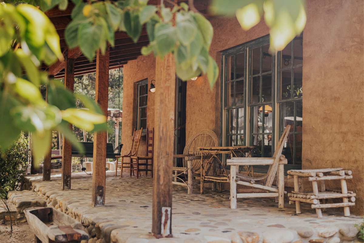 a patio with chairs and tables