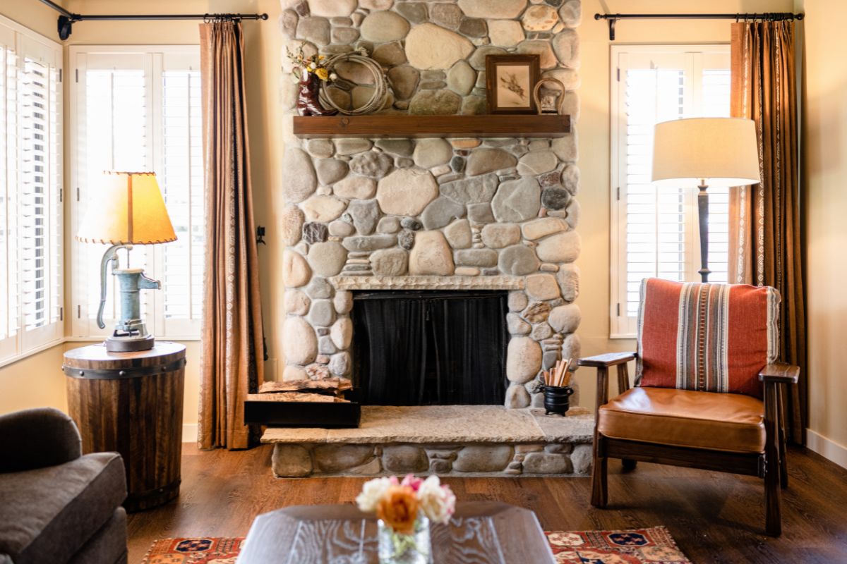 a living room with a fireplace and a couch