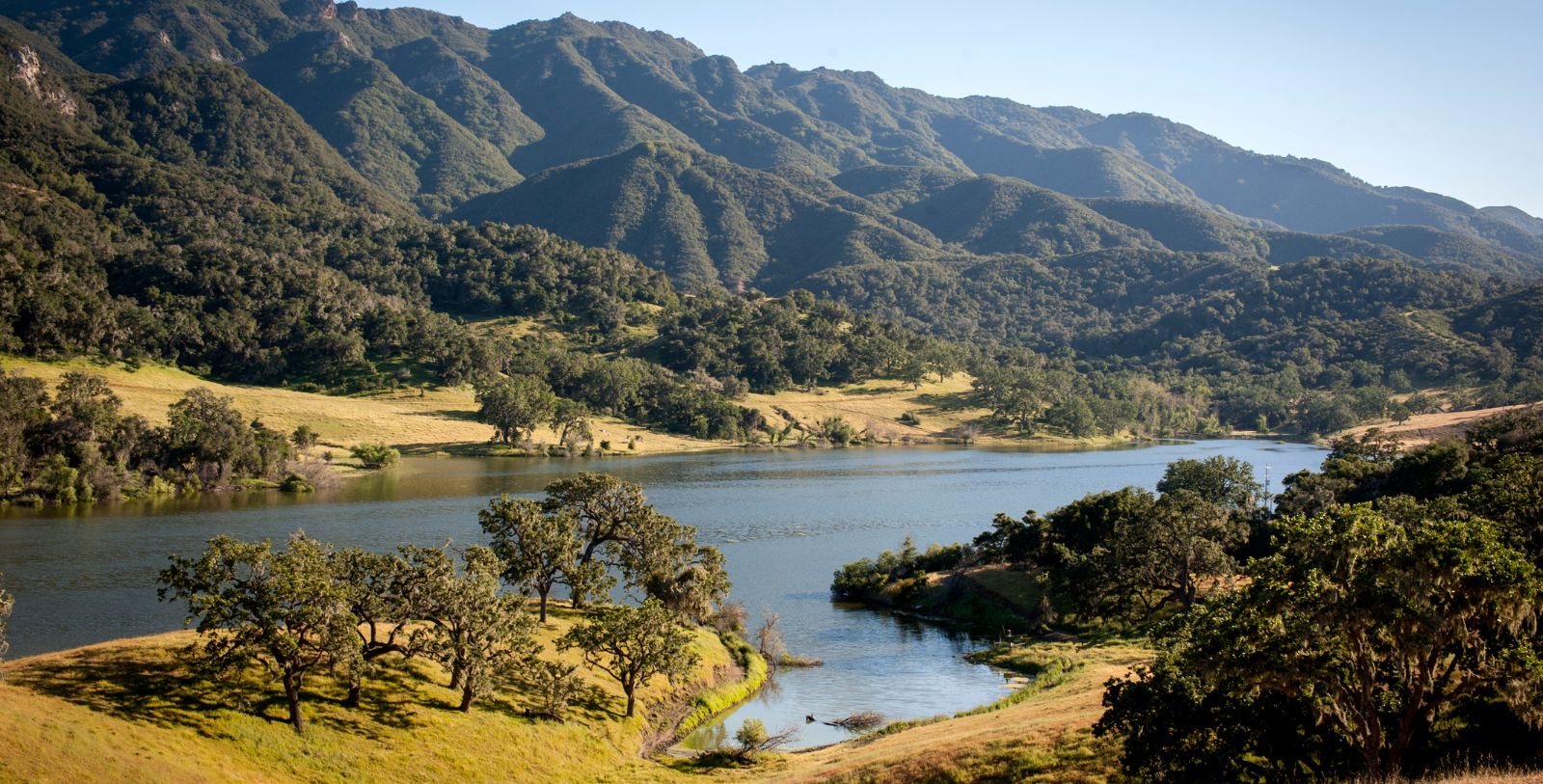 a lake surrounded by mountains