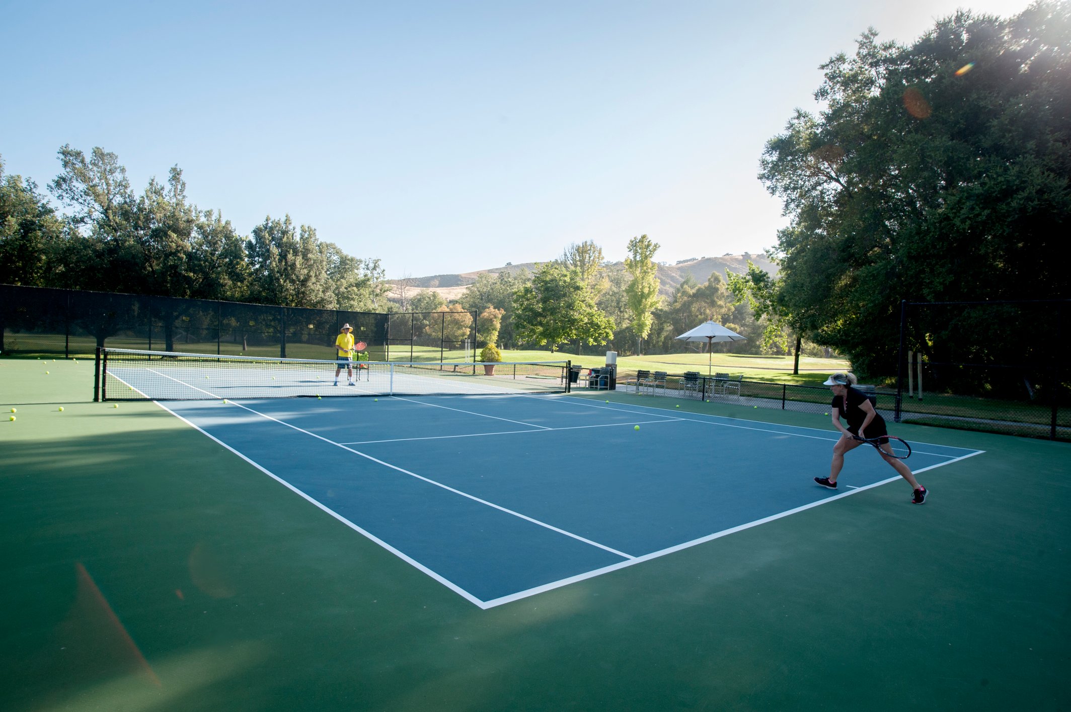 a two people playing tennis