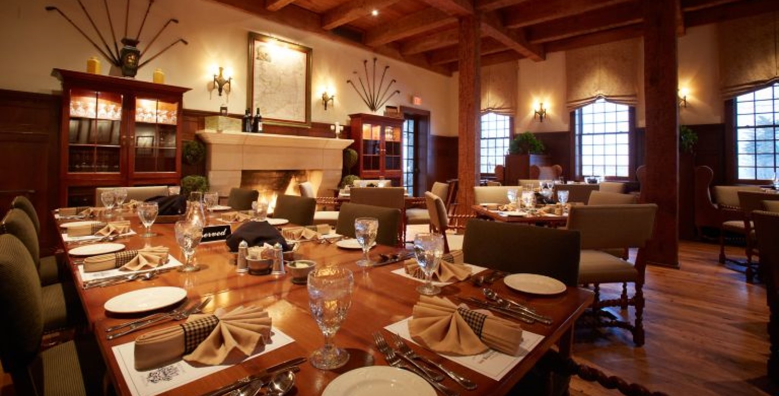 a restaurant with a fireplace and tables