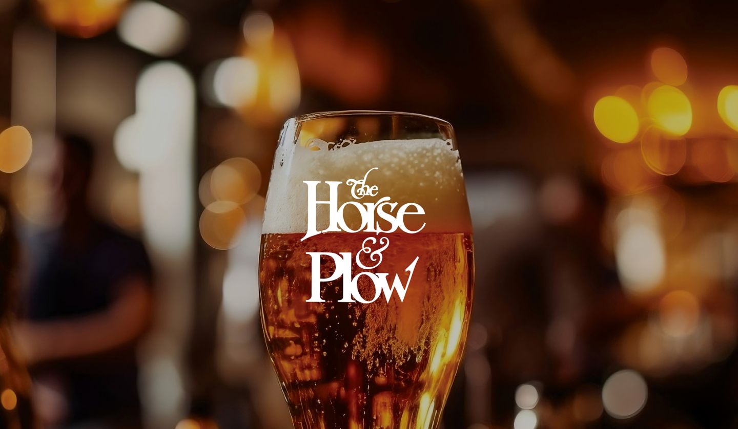 a glass of beer with foam