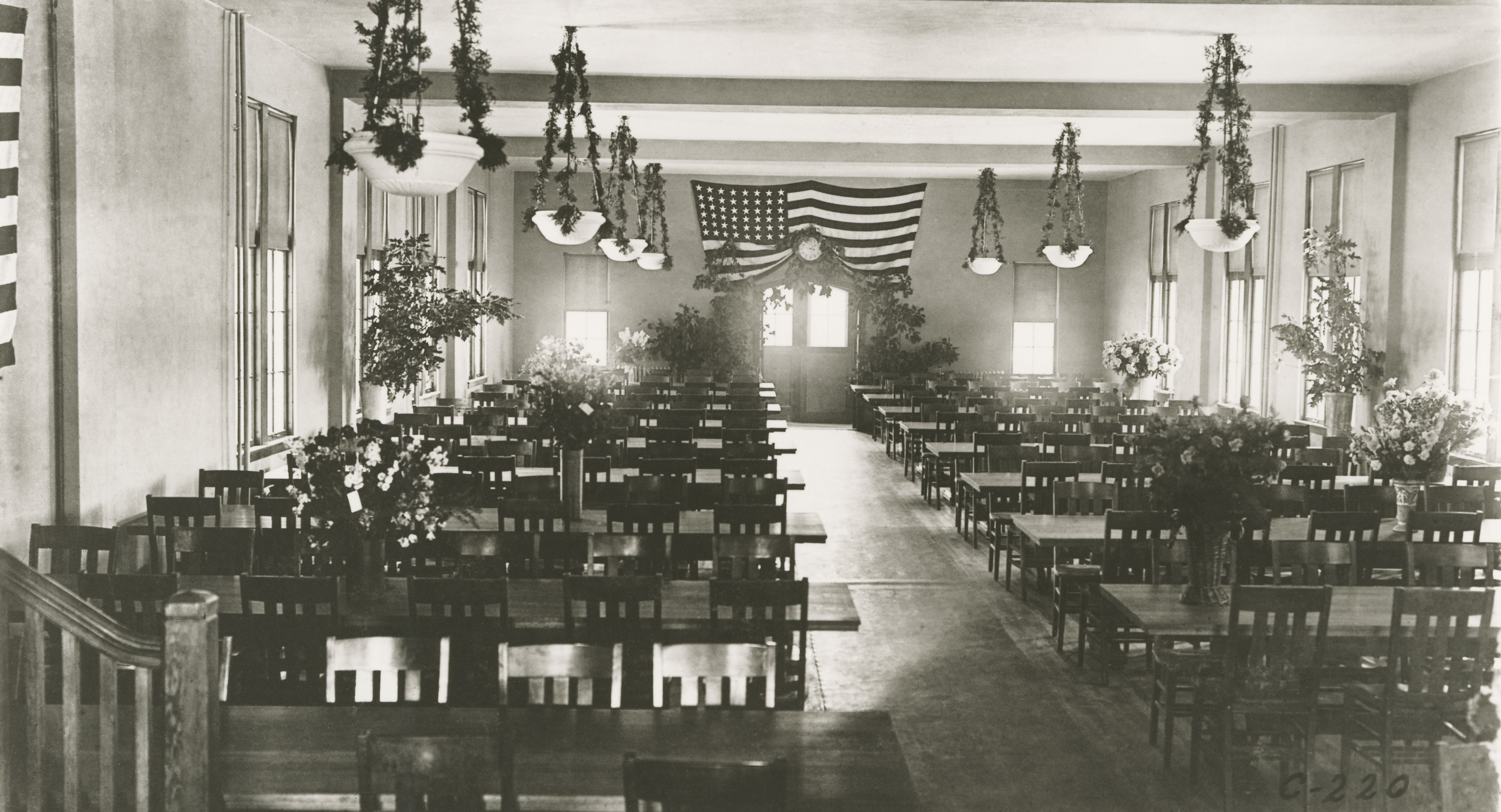 a room with chairs and a flag