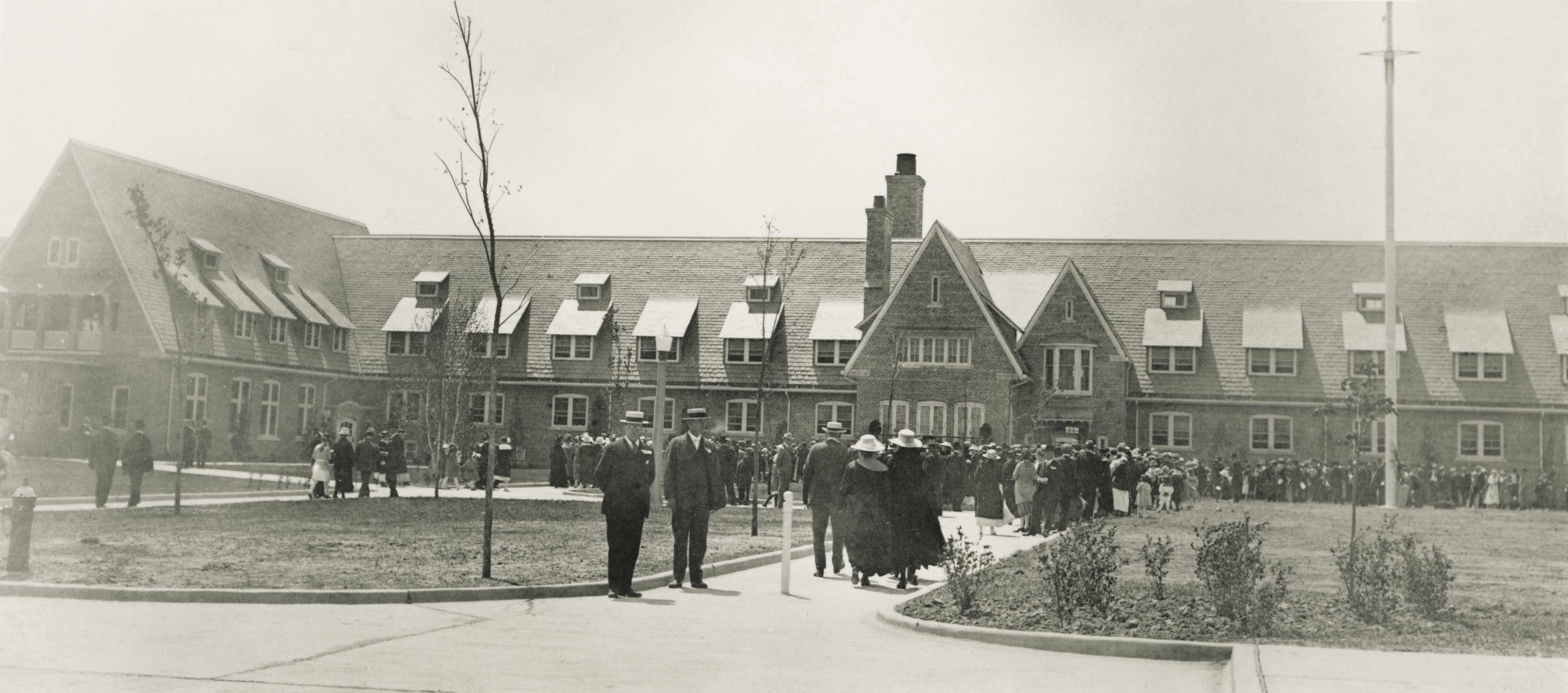 a group of people walking in front of a building