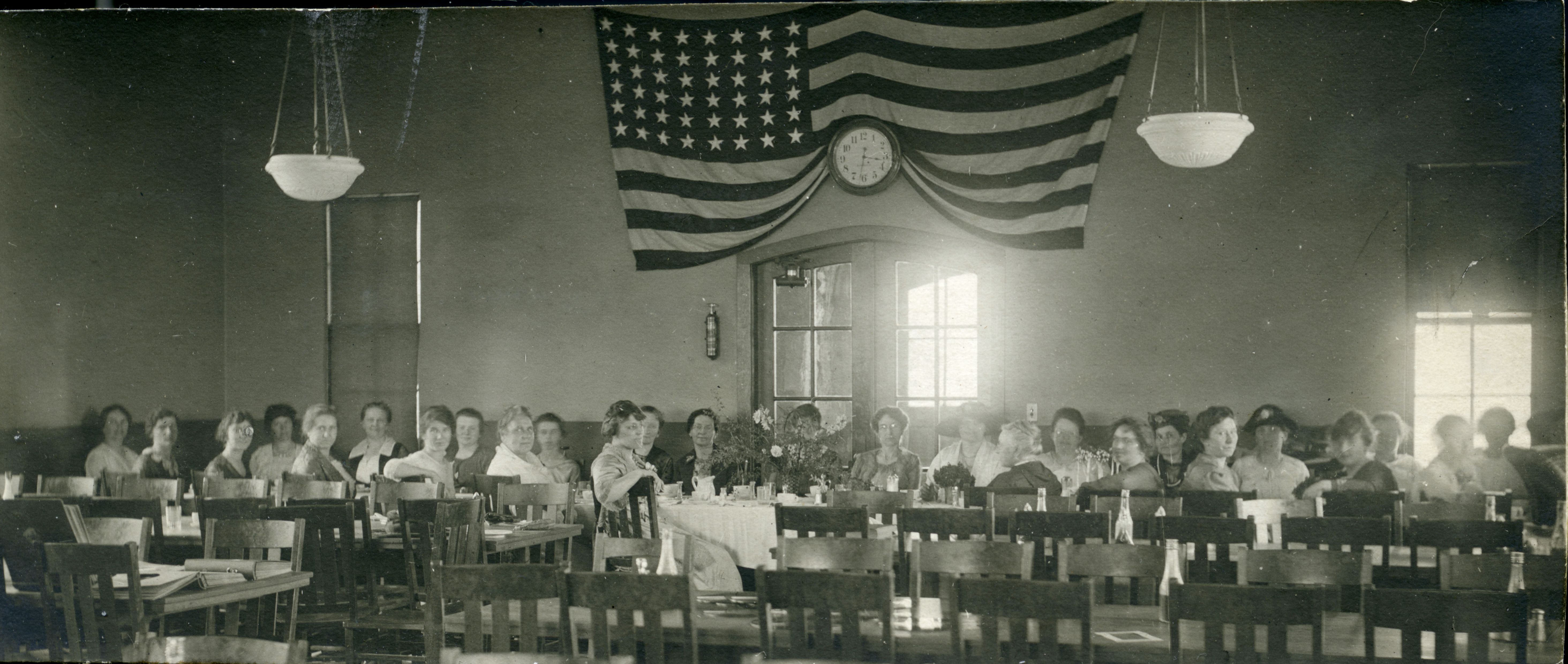 a group of people sitting at tables
