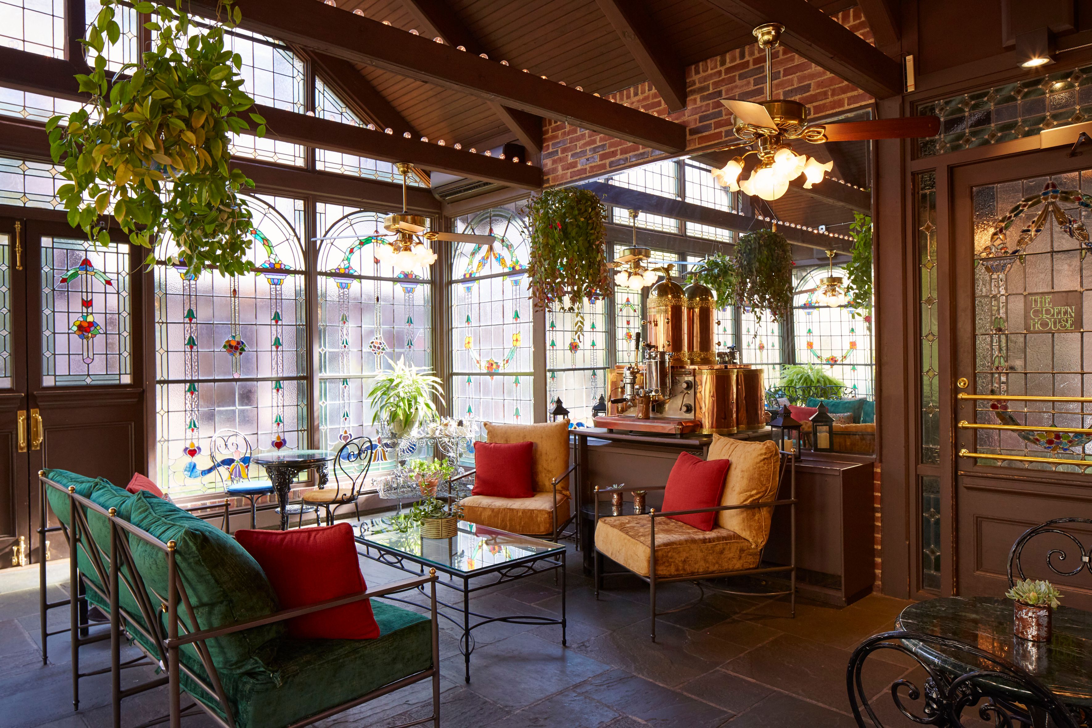 a room with a glass wall and a ceiling fan