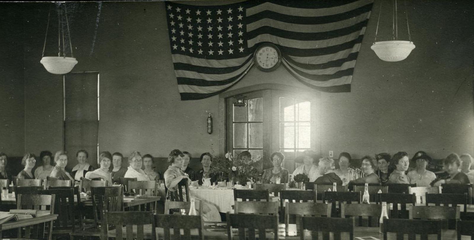 a group of people sitting at tables