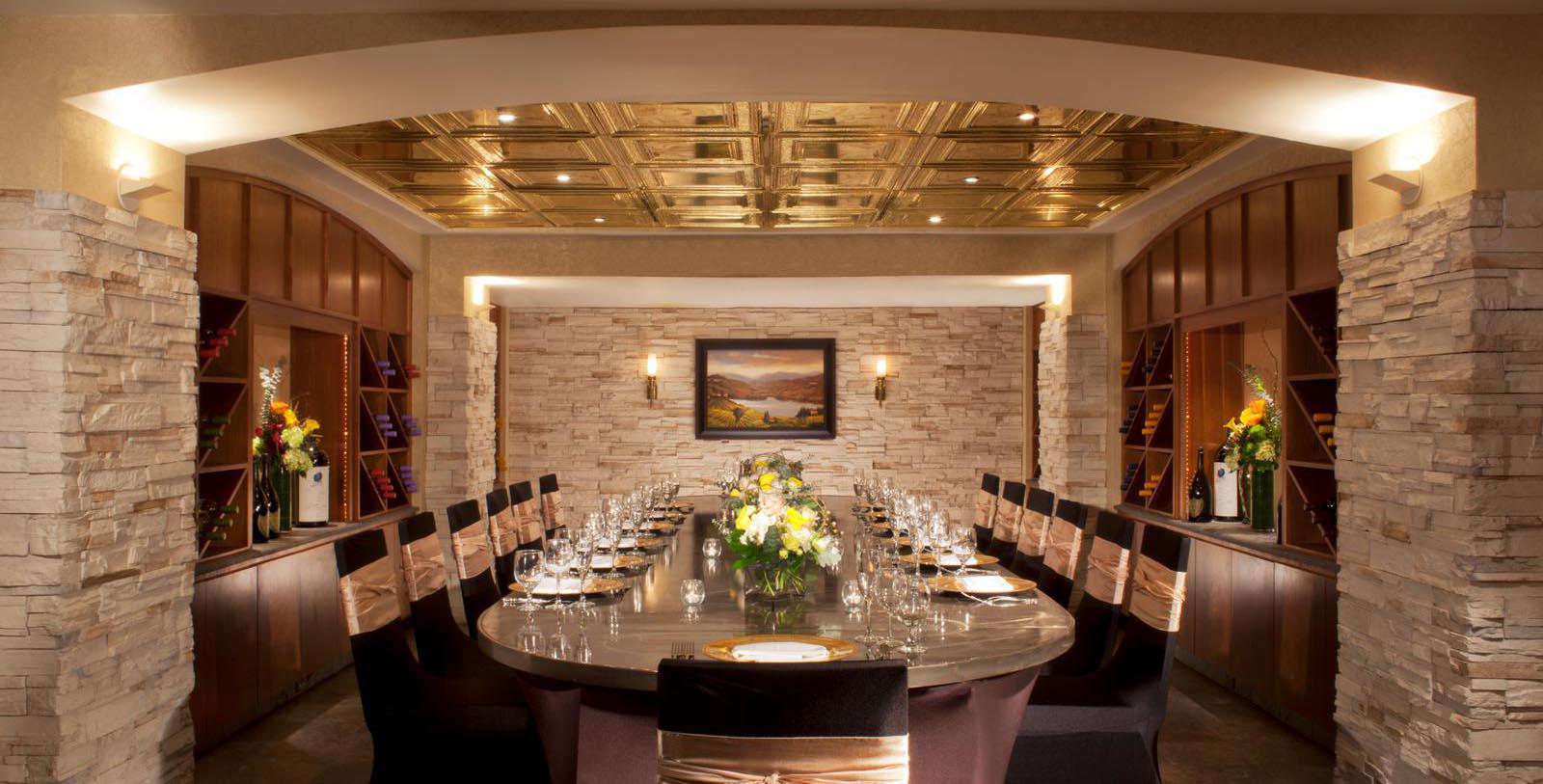 a room with a table set for a dinner