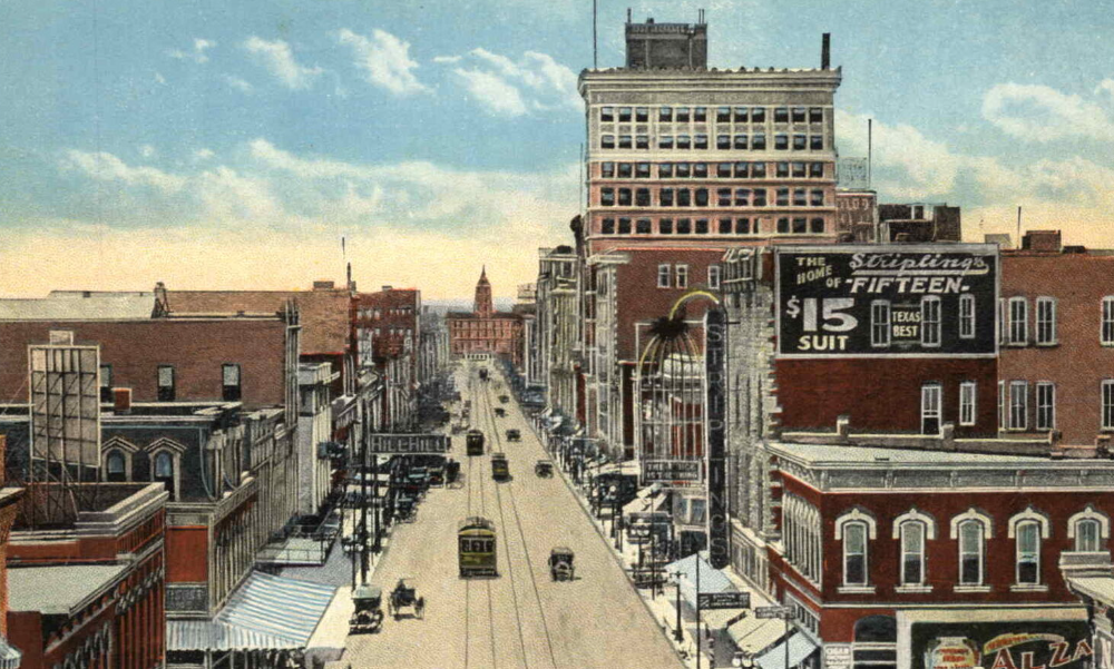 a city street with cars and buildings