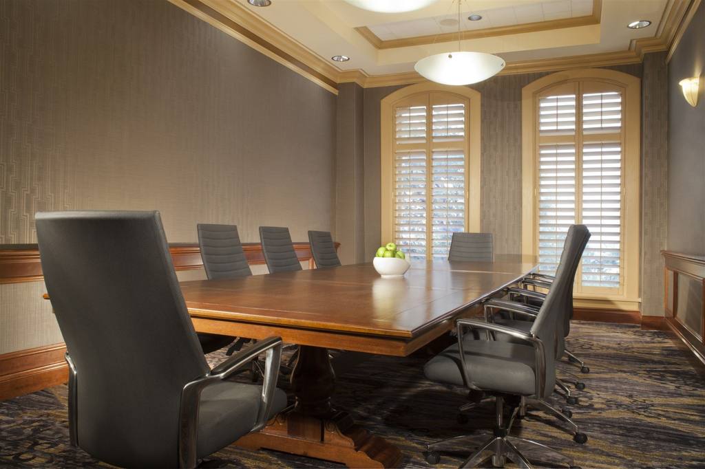 a conference room with a table and chairs