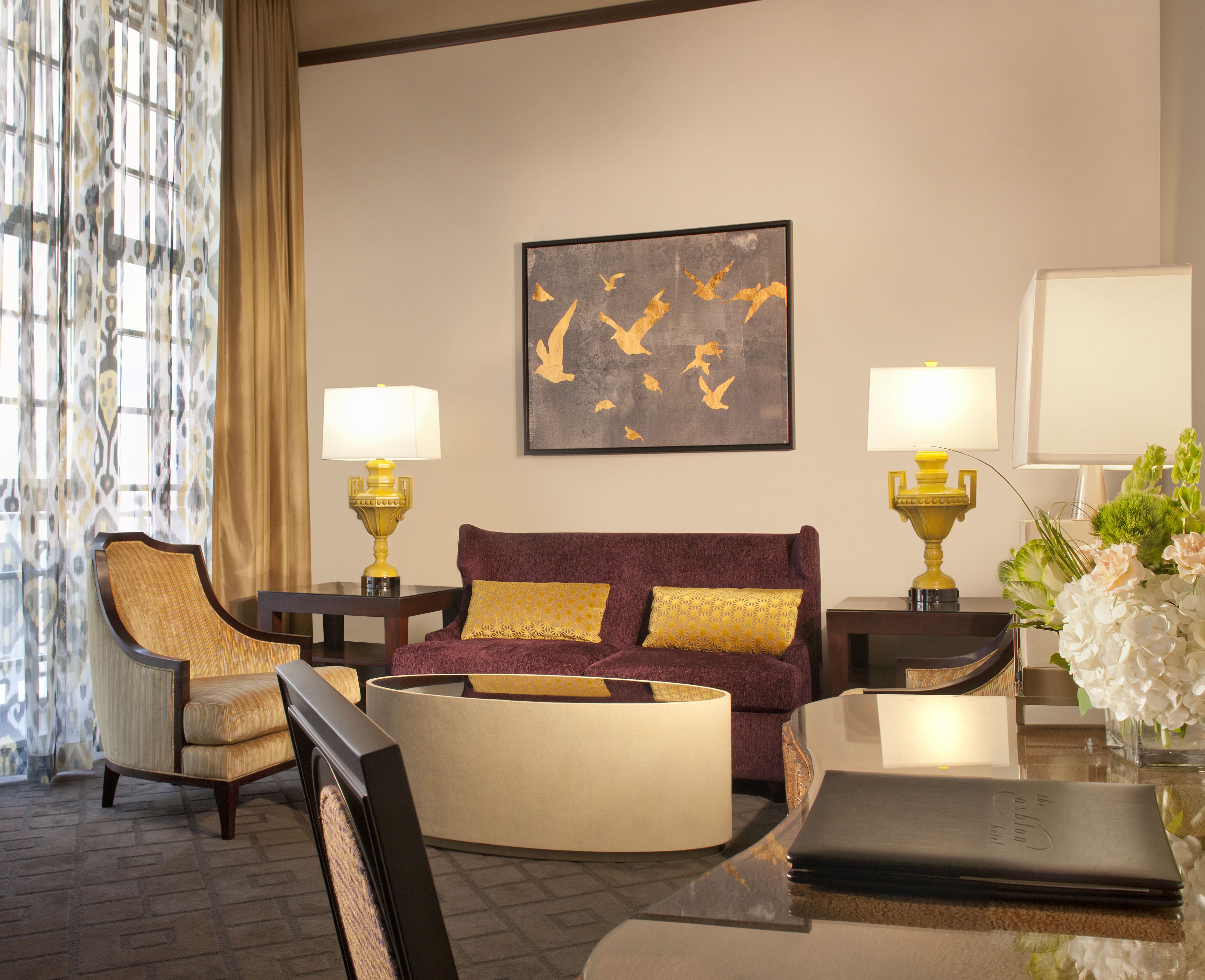 a living room with a couch and chairs