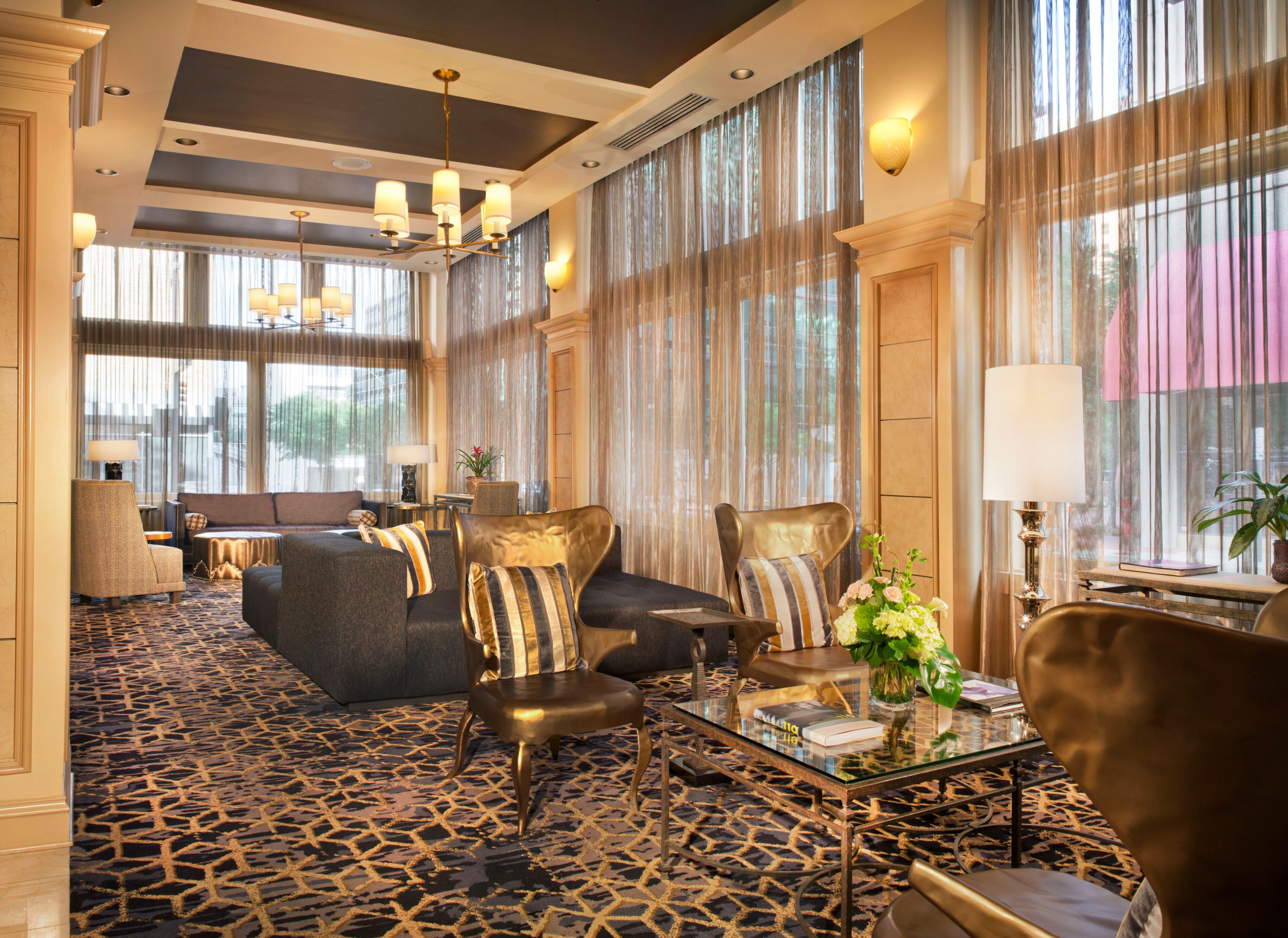 a room with a couch and chairs